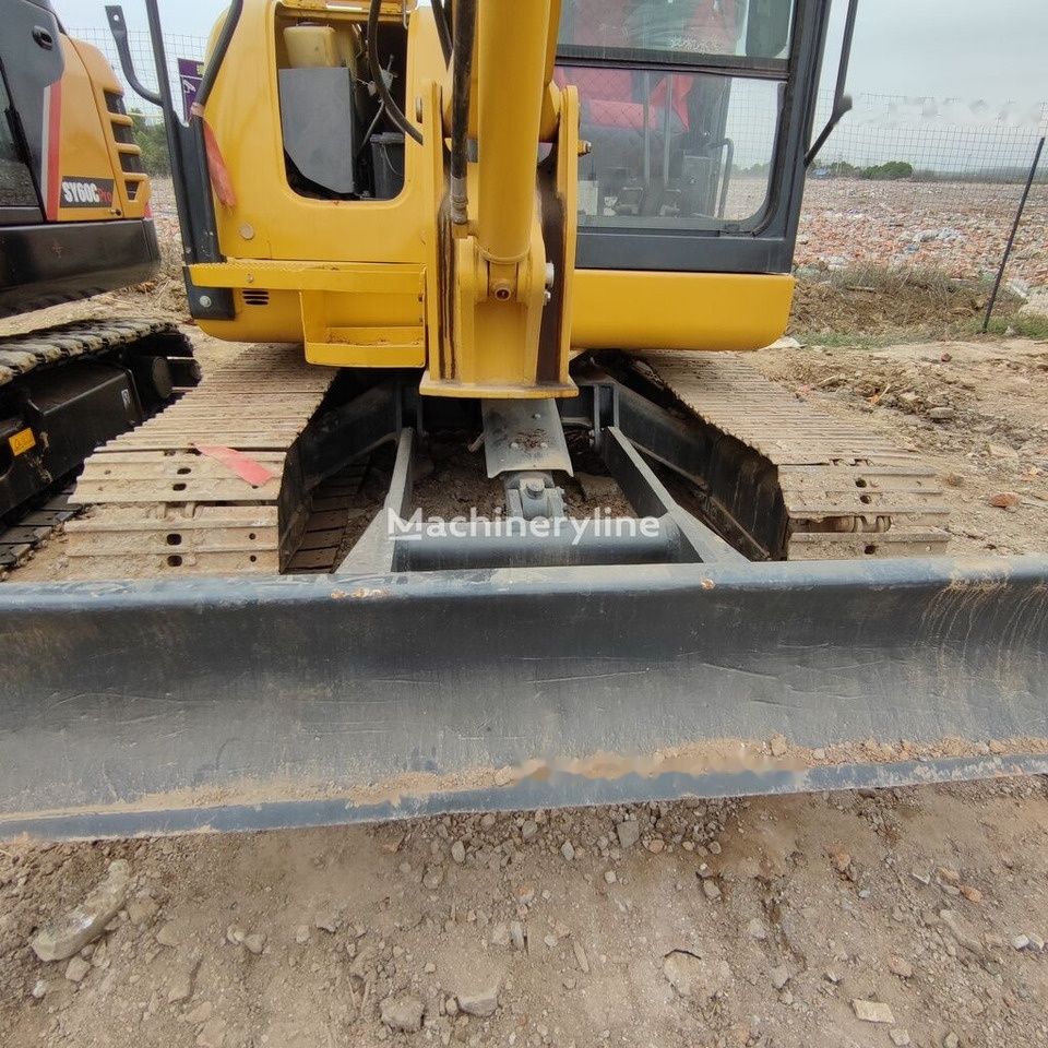 Komatsu PC56 mini excavator front view with blade