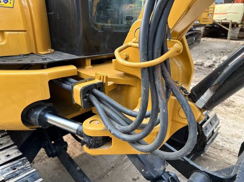 2022 Caterpillar 303CR mini excavator boom and hydraulic lines detail