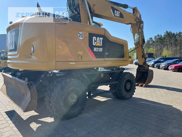 2015 Caterpillar M318F wheel excavator, rear three-quarter view 2015 Caterpillar M318F wheel excavator, rear three-quarter view