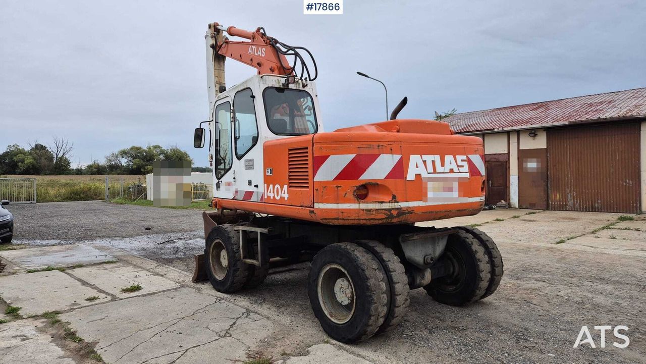 1995 Atlas 1404 wheel excavator, rear three-quarter view
