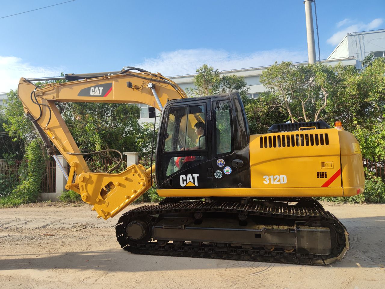 Caterpillar 312D crawler excavator, side profile view Caterpillar 312D crawler excavator, side profile view