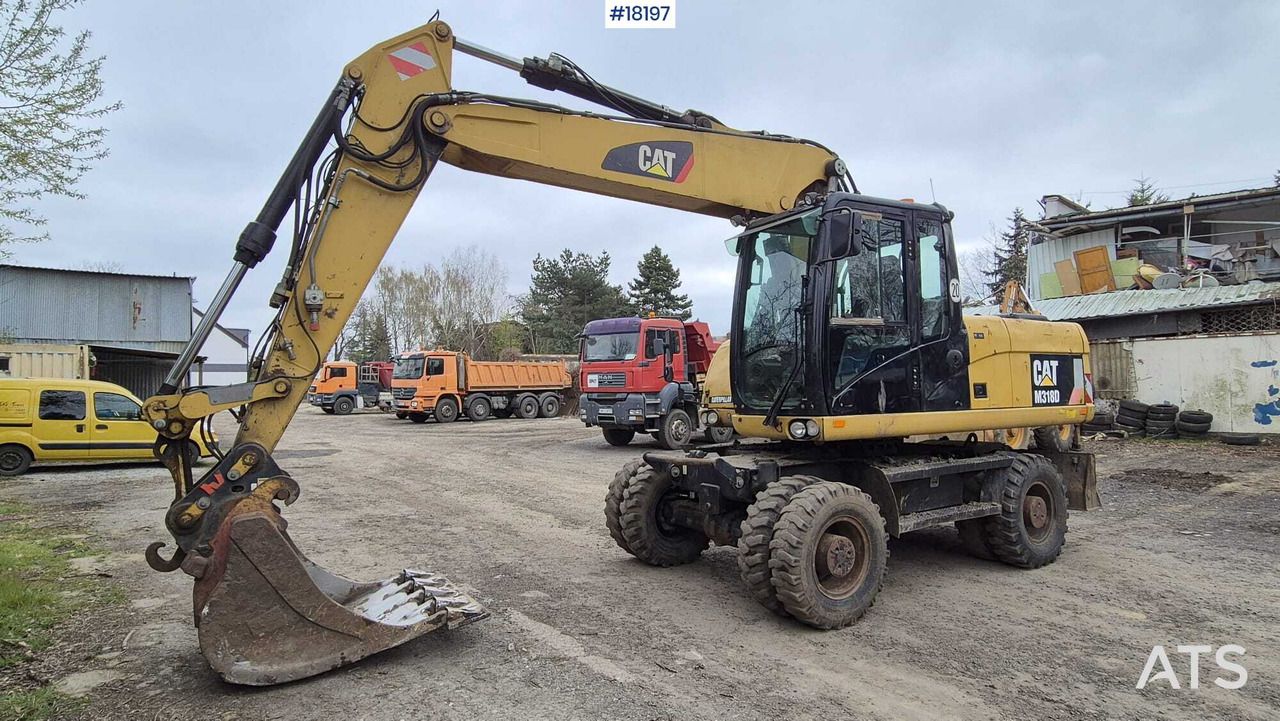 2010 Caterpillar M318D wheel excavator, front three-quarter view 2010 Caterpillar M318D wheel excavator, front three-quarter view