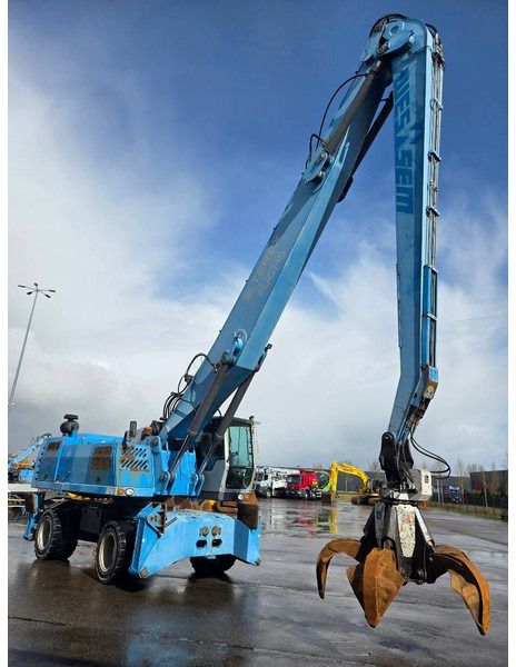 2011 Fuchs MHL360 D material handler, side view