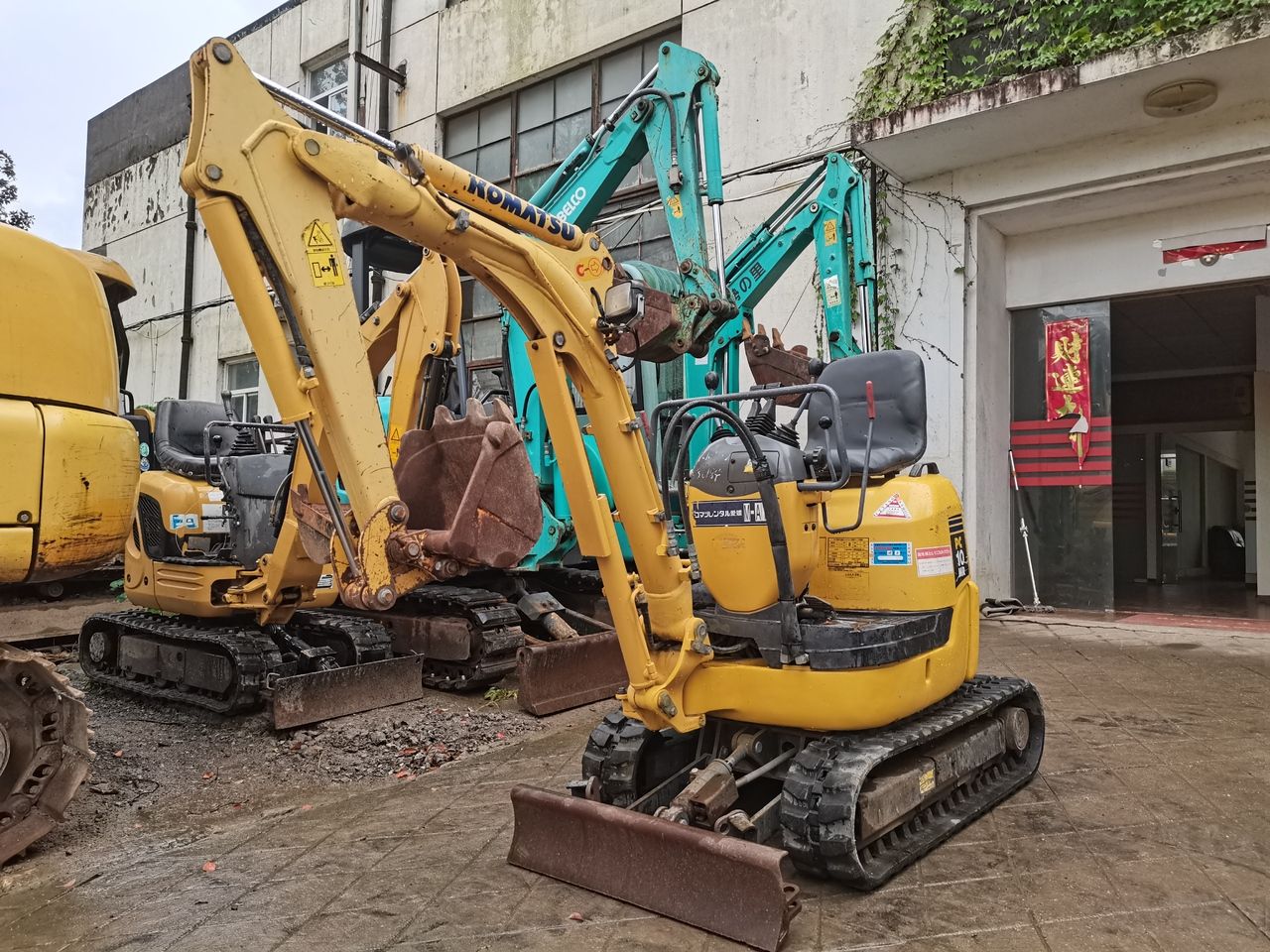 2014 Komatsu PC10MR crawler excavator, front three-quarter view