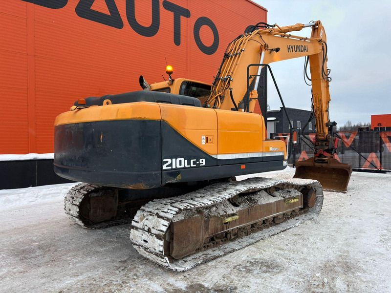 2012 Hyundai R210LC-9 crawler excavator, rear three-quarter view 2012 Hyundai R210LC-9 crawler excavator, rear three-quarter view