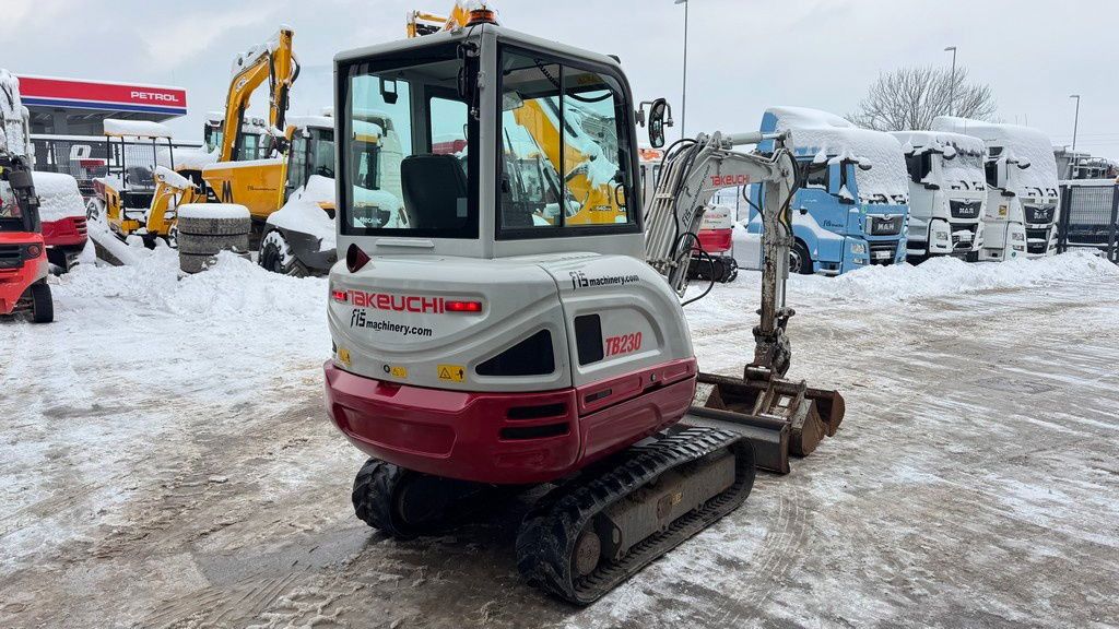 2017 Takeuchi TB230 mini excavator, rear three-quarter view