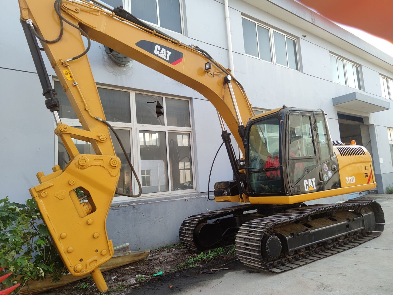 Caterpillar 312D crawler excavator, side view Caterpillar 312D crawler excavator, side view