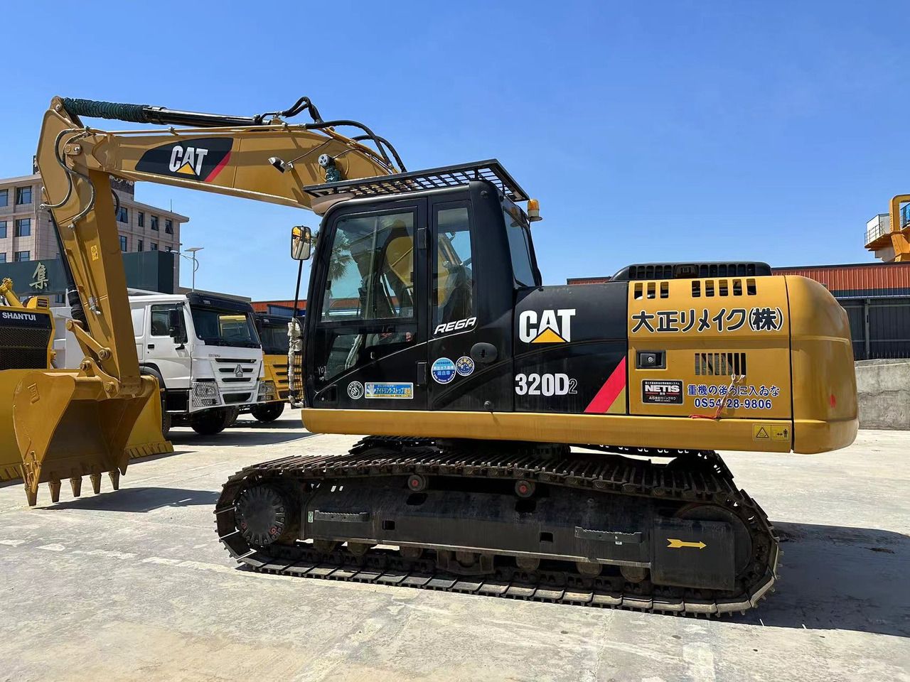 2025 Caterpillar 320D2 crawler excavator, side view