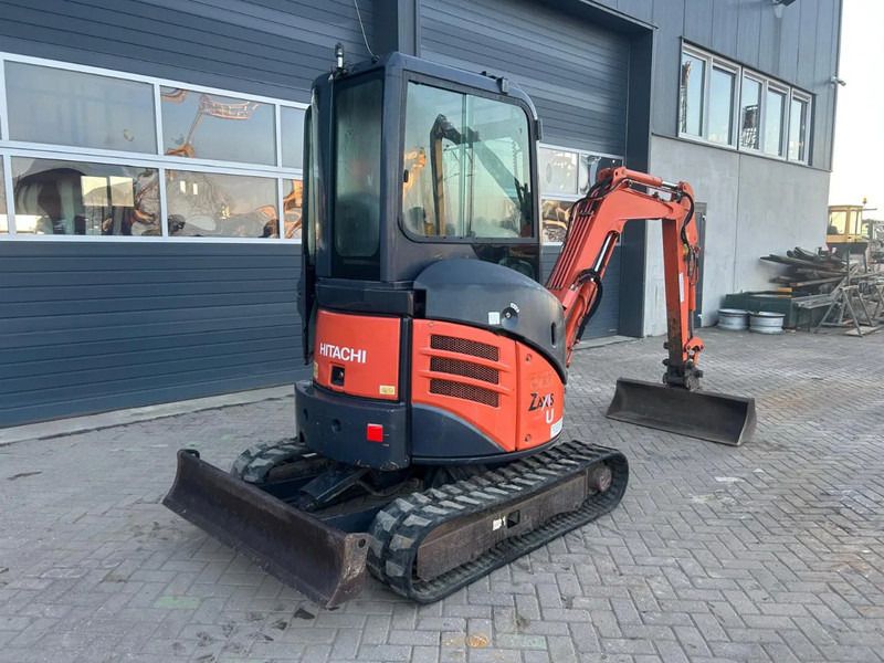 2011 Hitachi ZX22U-2 mini excavator, rear three-quarter view 2011 Hitachi ZX22U-2 mini excavator, rear three-quarter view