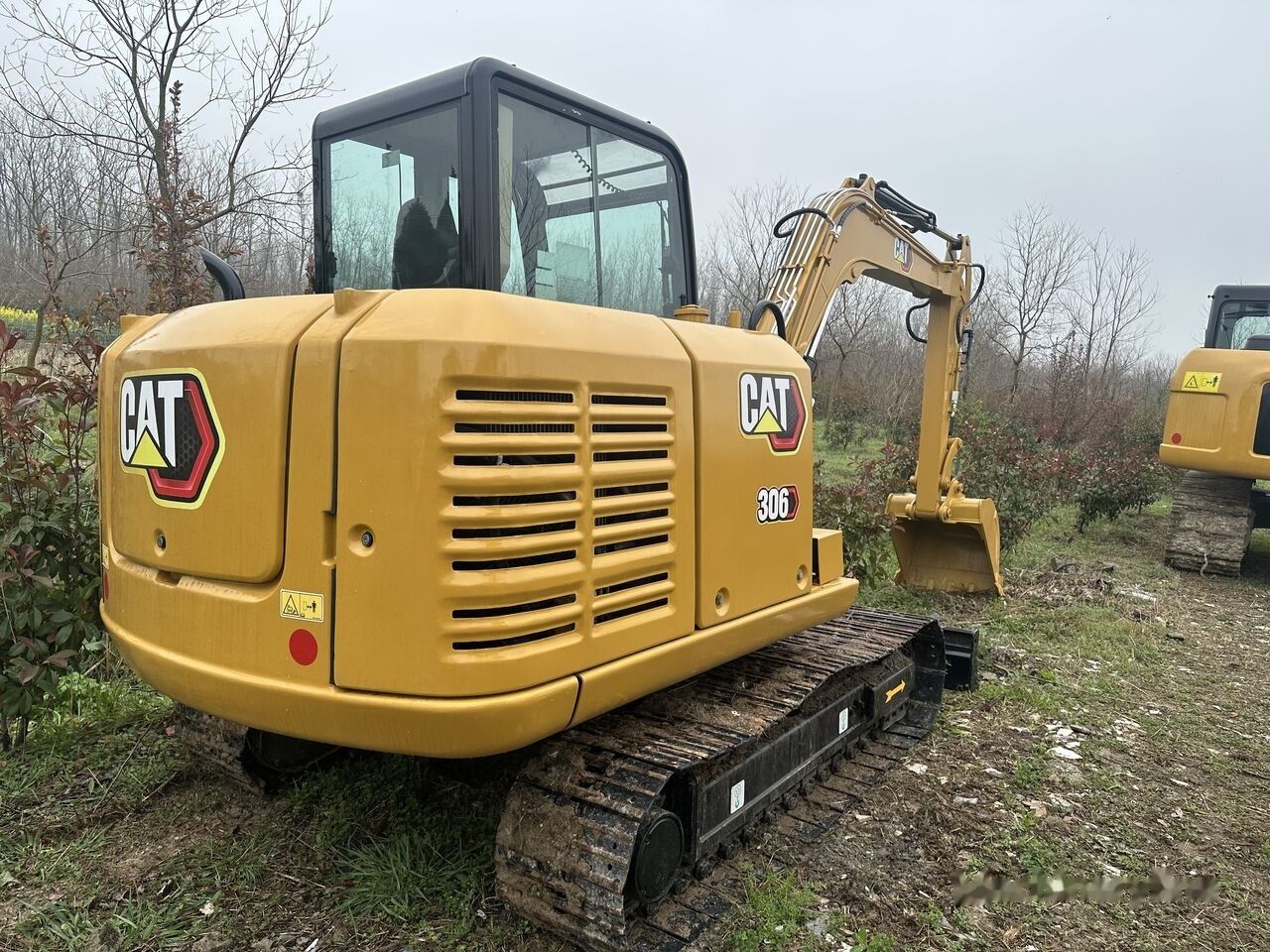 Caterpillar 306 mini excavator, rear three-quarter view