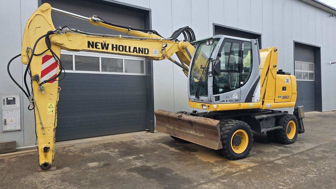 2011 New Holland WE150C wheel excavator, side view 2011 New Holland WE150C wheel excavator, side view
