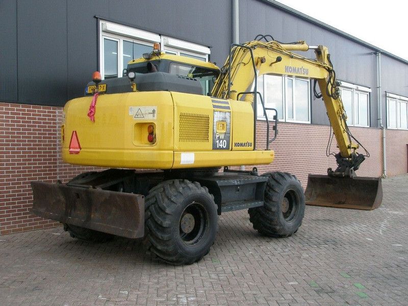 2008 Komatsu PW140-7 wheel excavator, rear three-quarter view 2008 Komatsu PW140-7 wheel excavator, rear three-quarter view