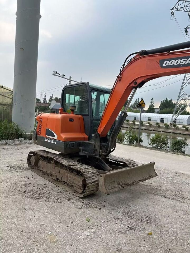 2018 Doosan DX55-9C mini excavator, side view 2018 Doosan DX55-9C mini excavator, side view