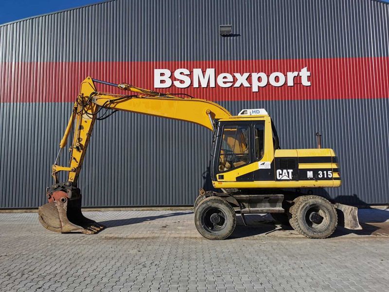 1996 Caterpillar M315 wheel excavator, side profile view 1996 Caterpillar M315 wheel excavator, side profile view