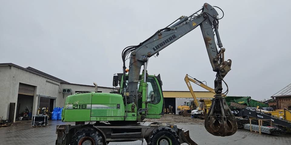 2011 Liebherr A316 LITRONIC wheel excavator side view