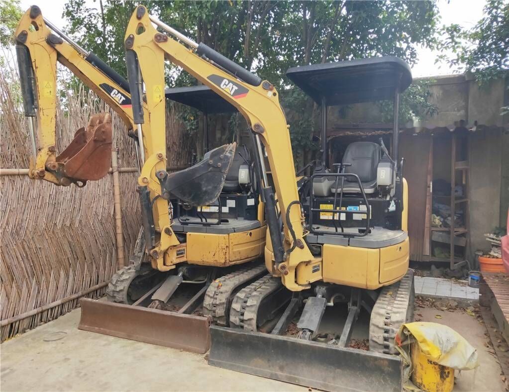 2018 Caterpillar 302C mini excavator, front three-quarter view