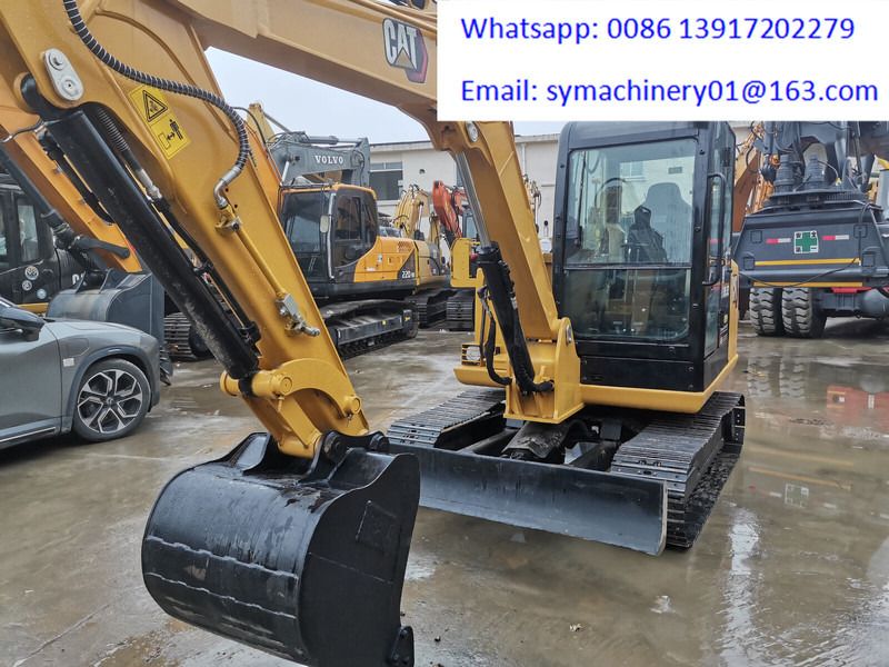 2023 Caterpillar 305.5E2 crawler excavator, front three-quarter view
