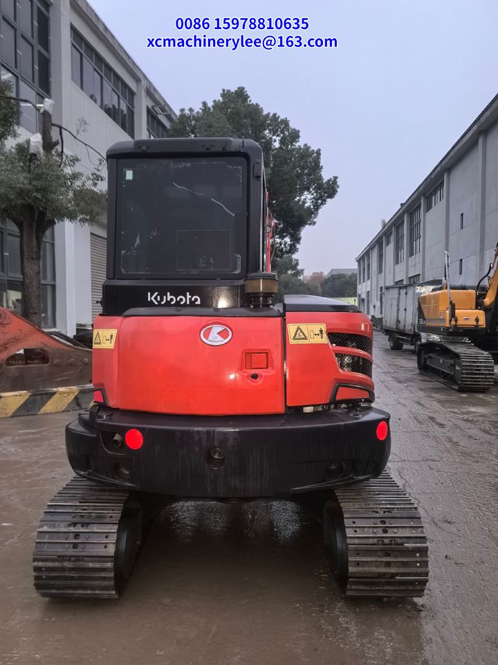 2023 Kubota KX057-4 mini excavator, rear view