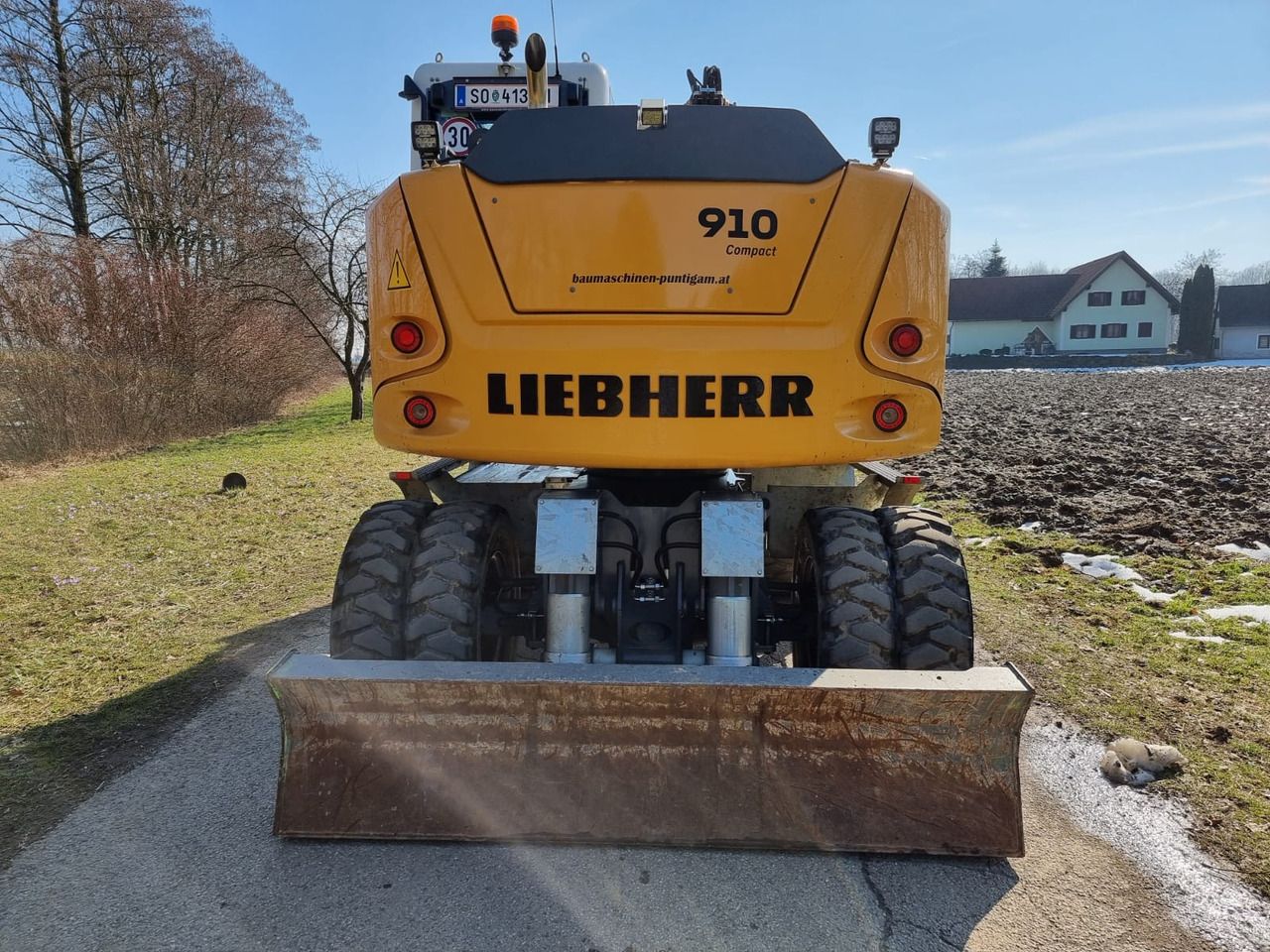 2024 Liebherr A910 Compact Litronic wheel excavator, rear view