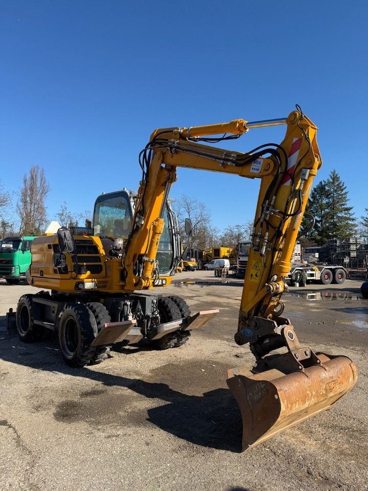 2012 New Holland MH 2.6 wheel excavator, side view 2012 New Holland MH 2.6 wheel excavator, side view