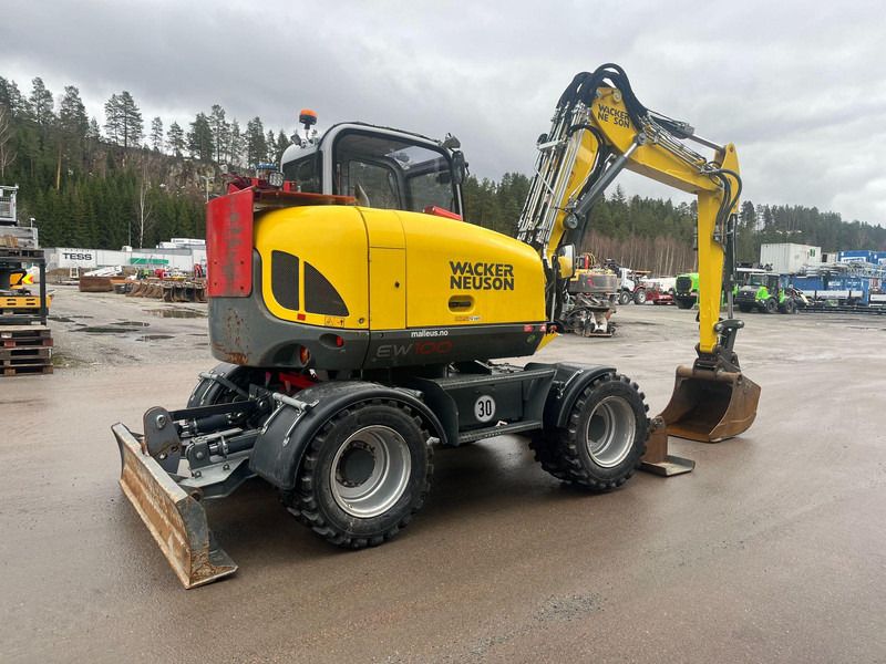 2022 Wacker Neuson EW100 wheel excavator, rear three-quarter view 2022 Wacker Neuson EW100 wheel excavator, rear three-quarter view