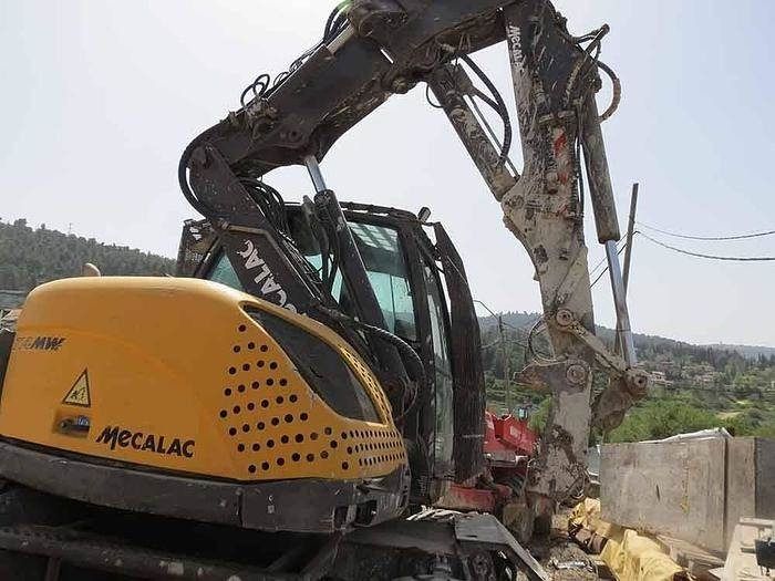 2013 Mecalac 714 MW wheel excavator rear three-quarter view