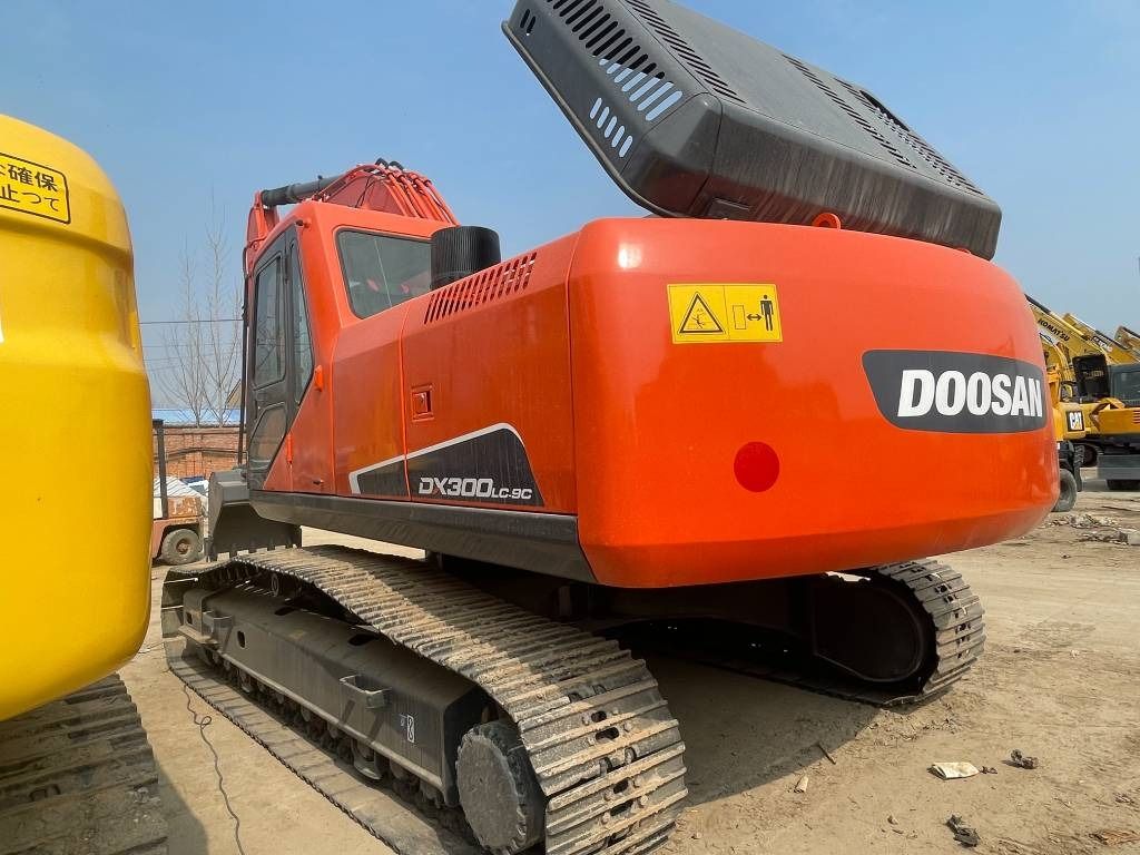 2025 Doosan DX300LC-9C crawler excavator, rear three-quarter view 2025 Doosan DX300LC-9C crawler excavator, rear three-quarter view