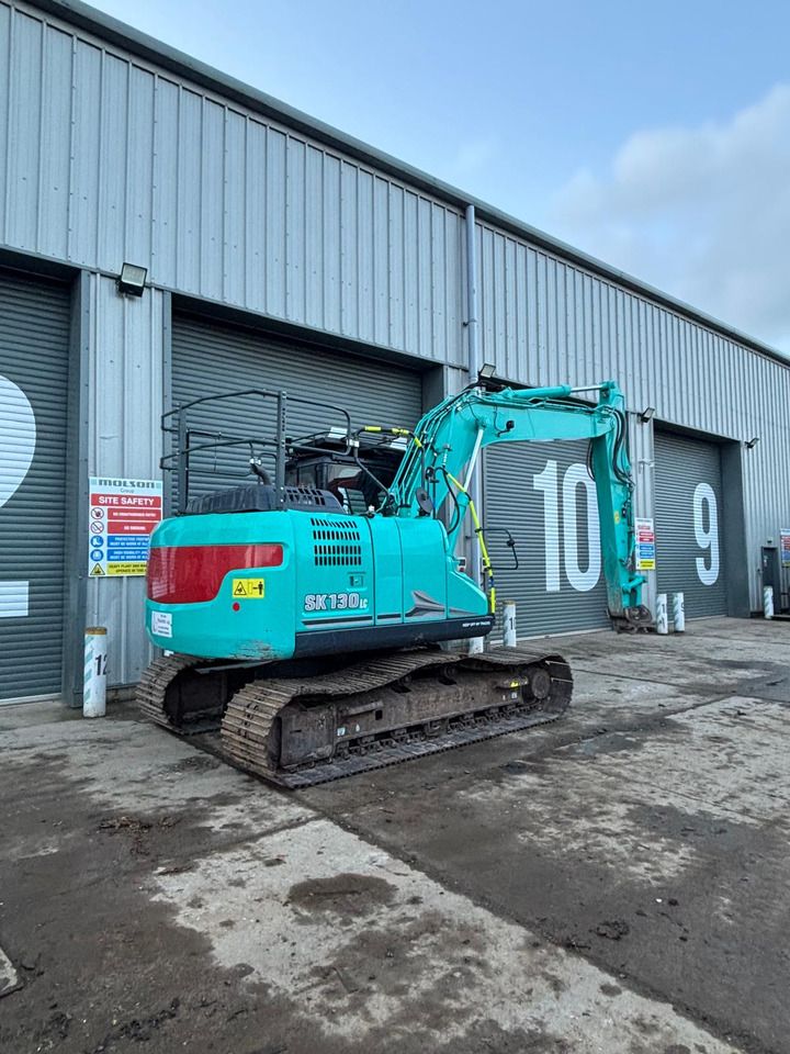 2022 Kobelco SK130LC-11 crawler excavator, rear three-quarter view 2022 Kobelco SK130LC-11 crawler excavator, rear three-quarter view