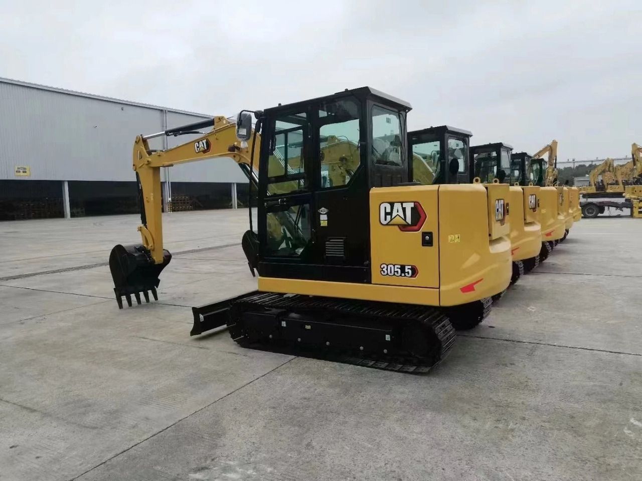 2023 Caterpillar 305.5E2 mini excavator, rear three-quarter view 2023 Caterpillar 305.5E2 mini excavator, rear three-quarter view