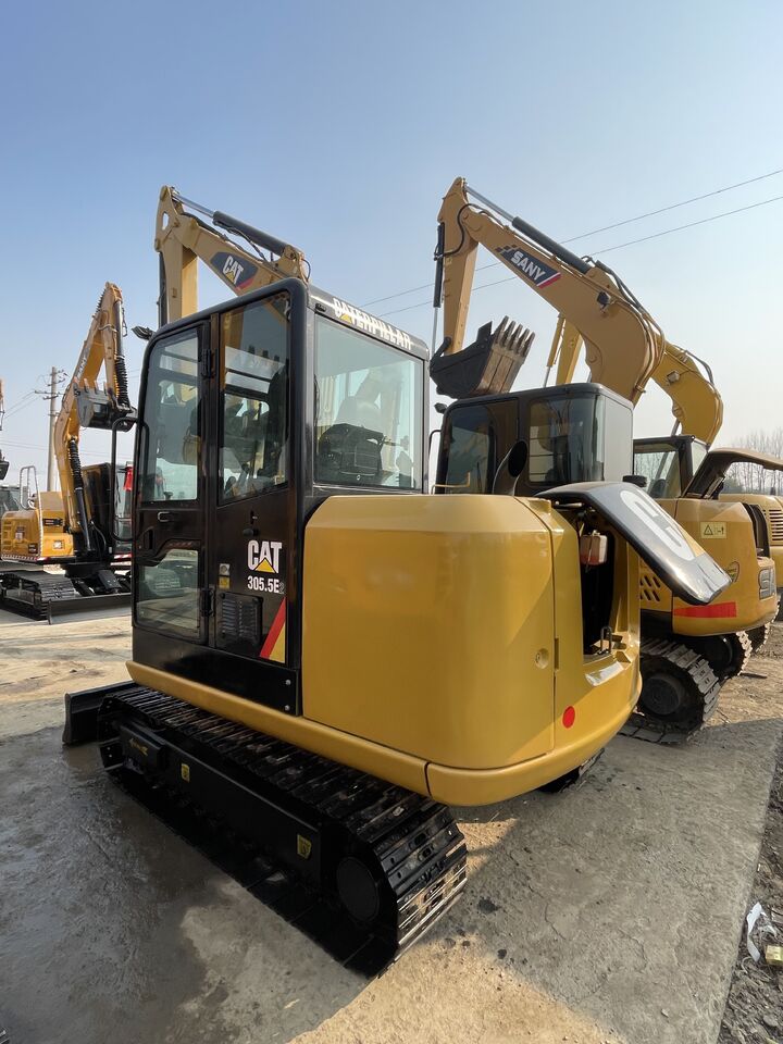 2024 Caterpillar 305.5E2 mini excavator, rear three-quarter view