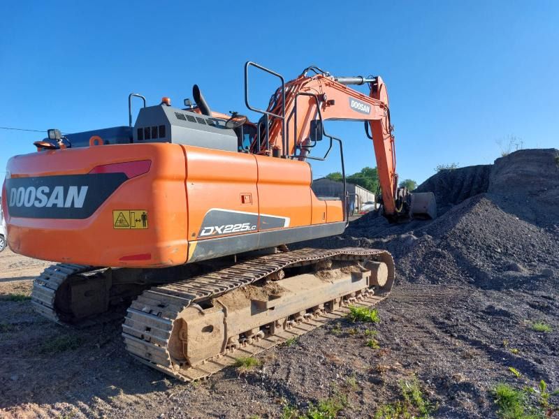 2021 Doosan DX225LC-5 crawler excavator, rear three-quarter view