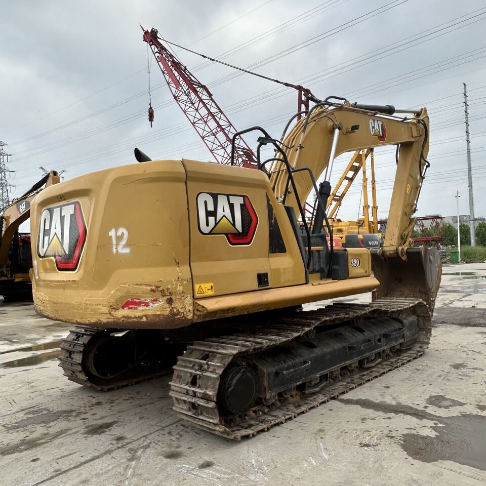2018 Caterpillar 320 excavator, rear three-quarter view