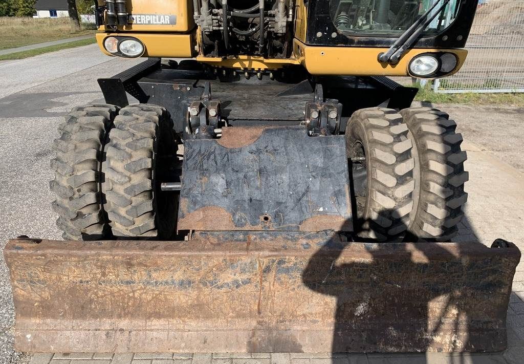 2008 Caterpillar M318D wheel excavator front view with dozer blade 2008 Caterpillar M318D wheel excavator front view with dozer blade