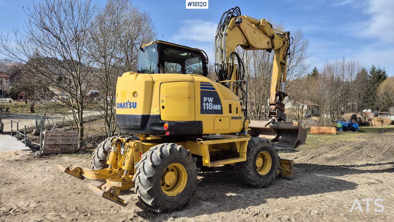 2013 Komatsu PW118 MR-8 wheel excavator, rear three-quarter view 2013 Komatsu PW118 MR-8 wheel excavator, rear three-quarter view