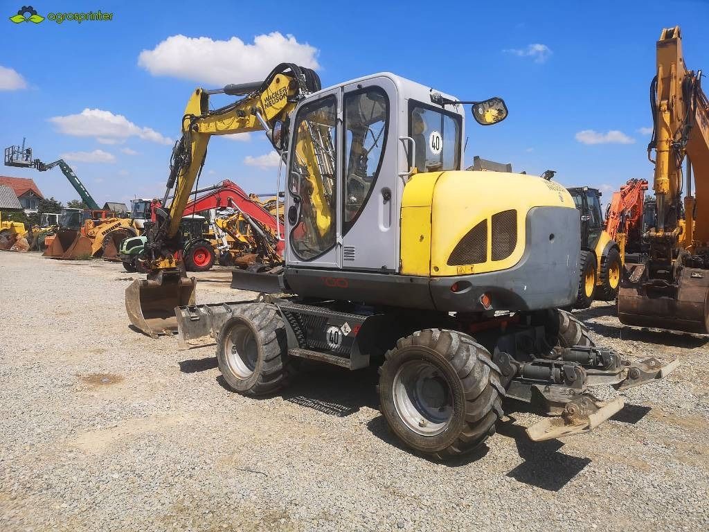 2014 Wacker Neuson EW100 wheel excavator, rear three-quarter view 2014 Wacker Neuson EW100 wheel excavator, rear three-quarter view