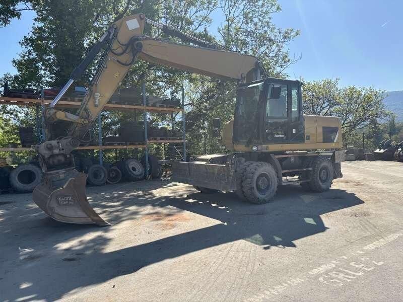 2014 Caterpillar M318D wheel excavator, front three-quarter view 2014 Caterpillar M318D wheel excavator, front three-quarter view