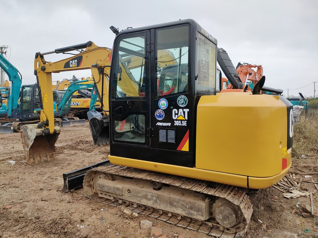 2024 Caterpillar 305.5E mini excavator, rear three-quarter view 2024 Caterpillar 305.5E mini excavator, rear three-quarter view