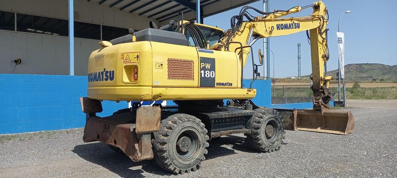 2016 Komatsu PW180-7EO wheel excavator, rear three-quarter view 2016 Komatsu PW180-7EO wheel excavator, rear three-quarter view