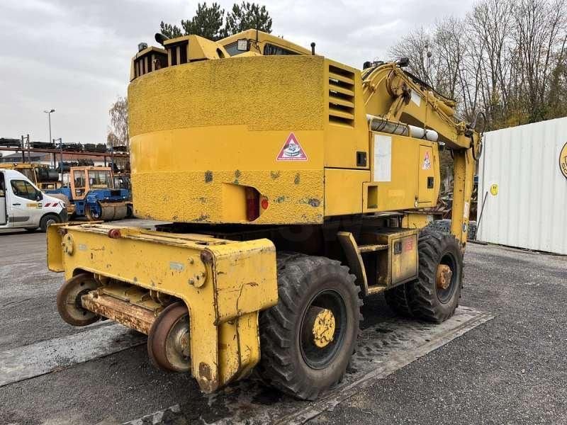 1997 CASE 788-PRR wheel excavator, rear three-quarter view