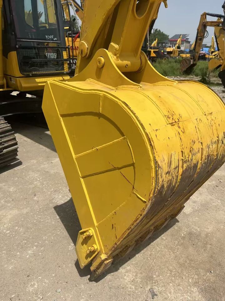 2023 Komatsu PC130-7 crawler excavator bucket close-up 2023 Komatsu PC130-7 crawler excavator bucket close-up