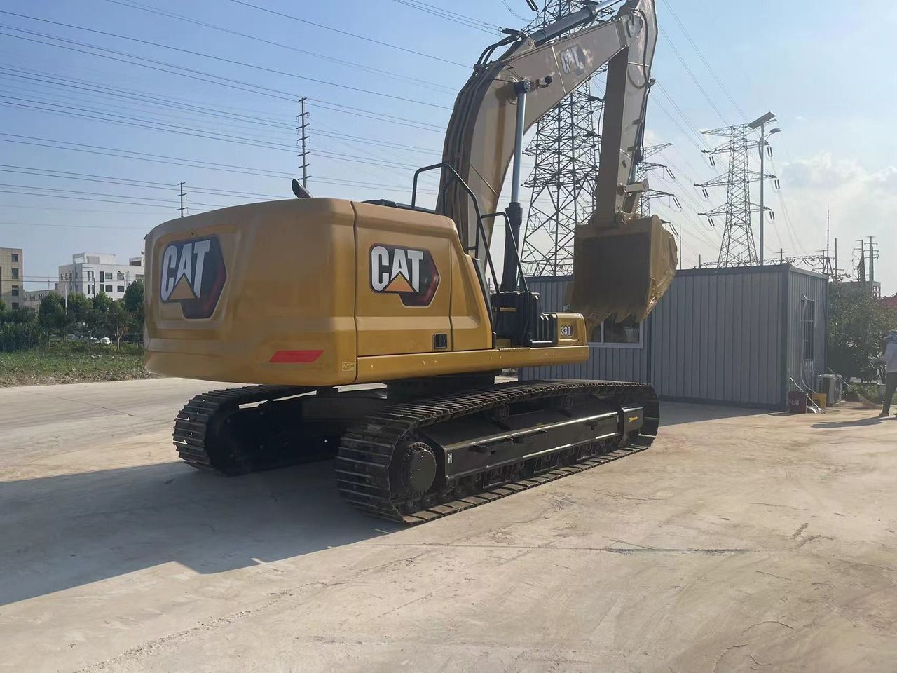 2022 Caterpillar 330GC crawler excavator, rear three-quarter view 2022 Caterpillar 330GC crawler excavator, rear three-quarter view