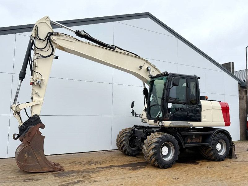 2011 Caterpillar M316D wheel excavator side view 2011 Caterpillar M316D wheel excavator side view