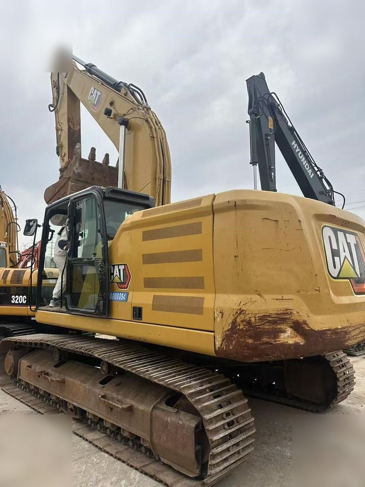 2019 Caterpillar 330 crawler excavator, rear three-quarter view