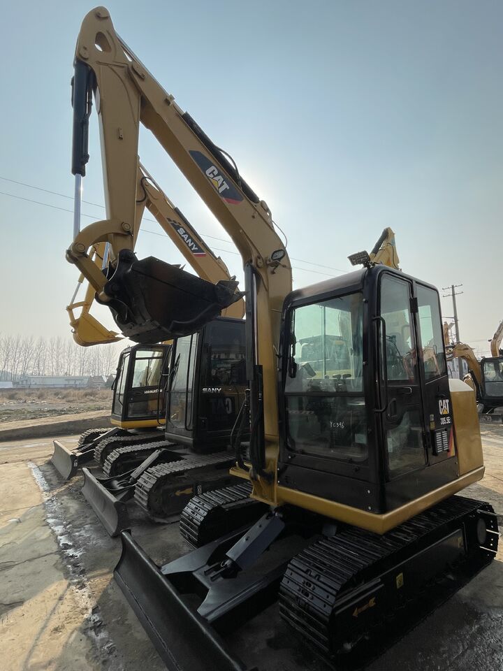 2024 Caterpillar 305.5E2 mini excavator, front three-quarter view