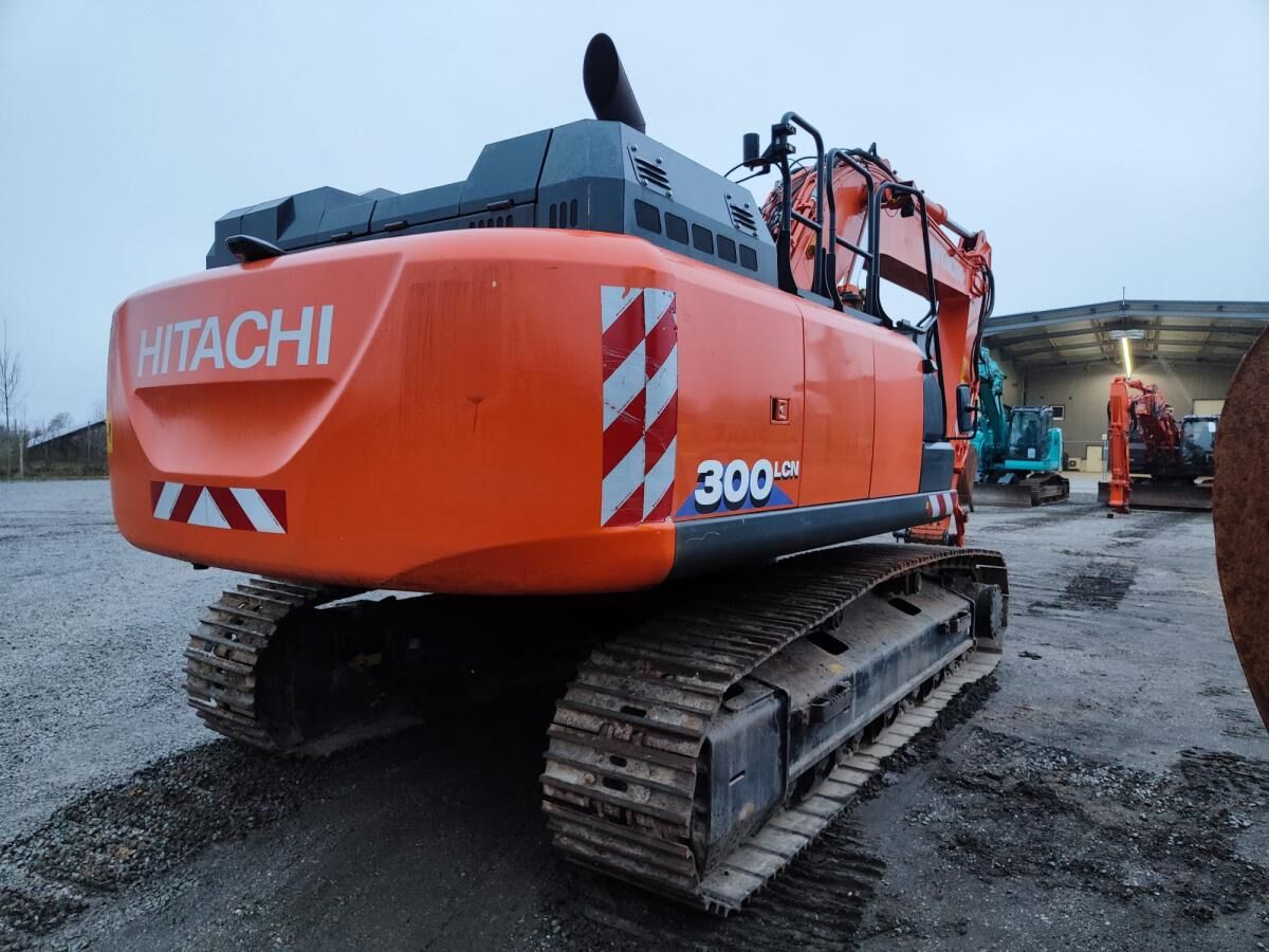 2019 Hitachi ZX300LCN-6 crawler excavator, rear three-quarter view 2019 Hitachi ZX300LCN-6 crawler excavator, rear three-quarter view
