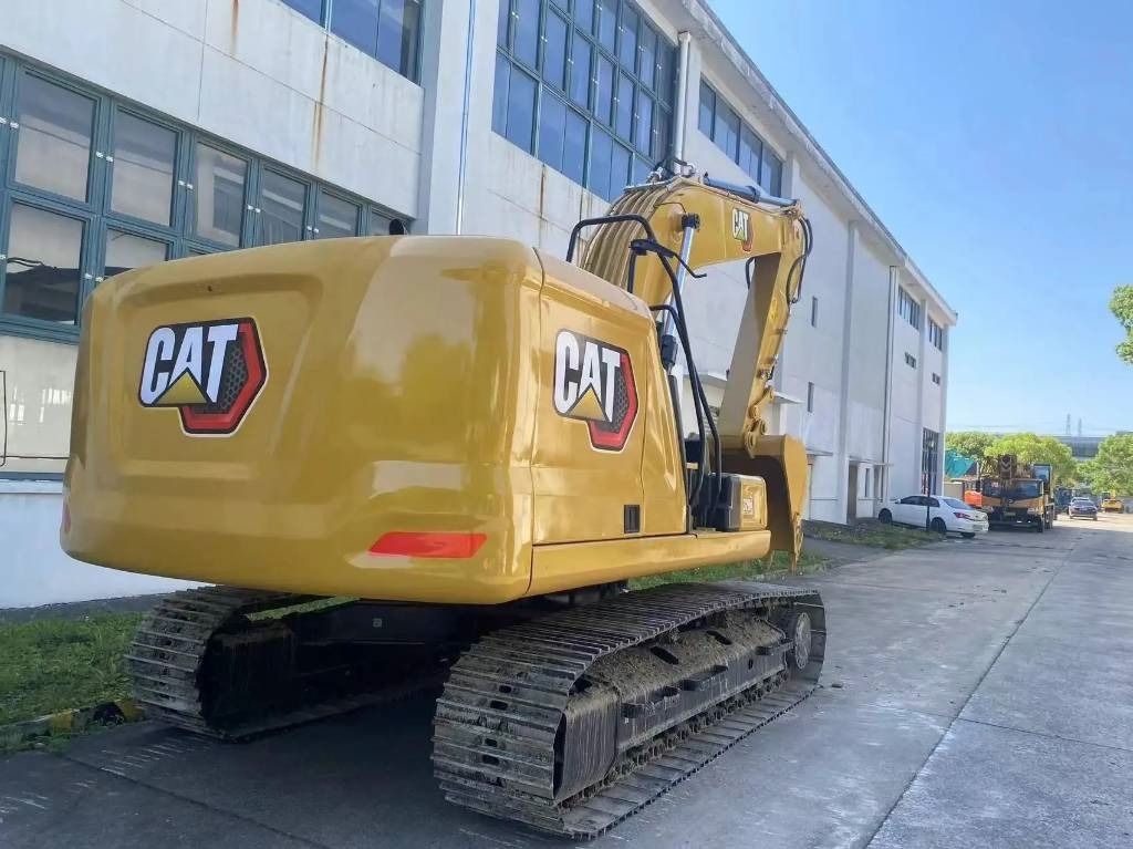 2024 Caterpillar 320GC crawler excavator, rear three-quarter view