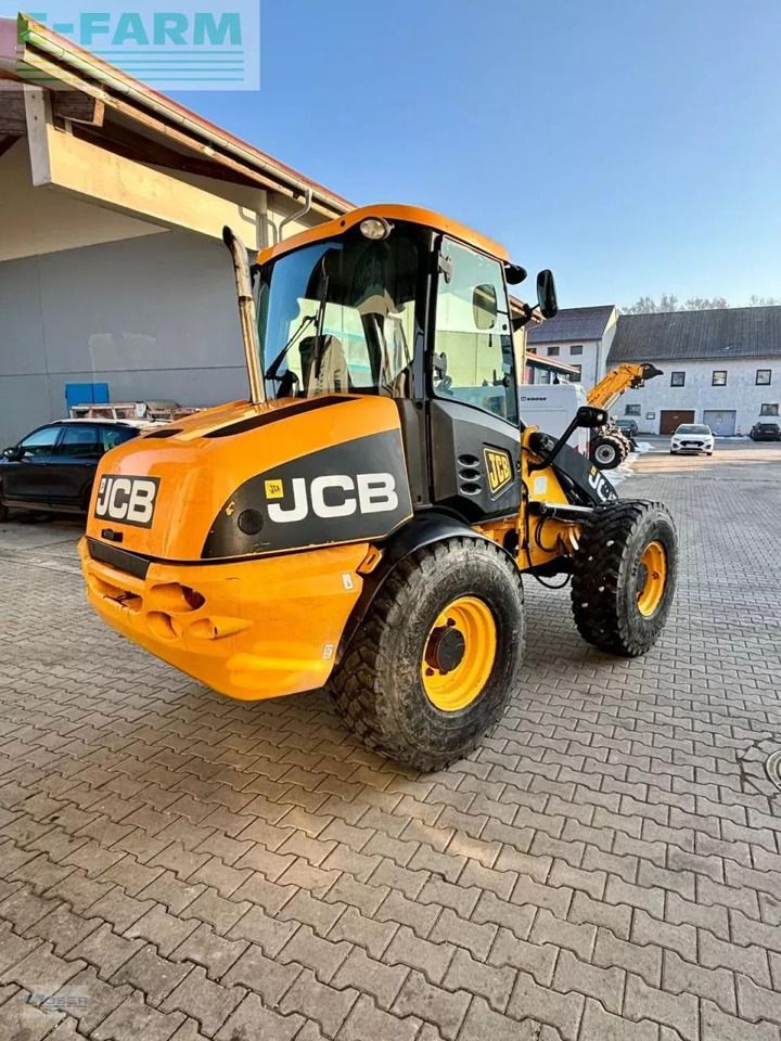 2011 JCB 409 wheel loader, rear three-quarter view