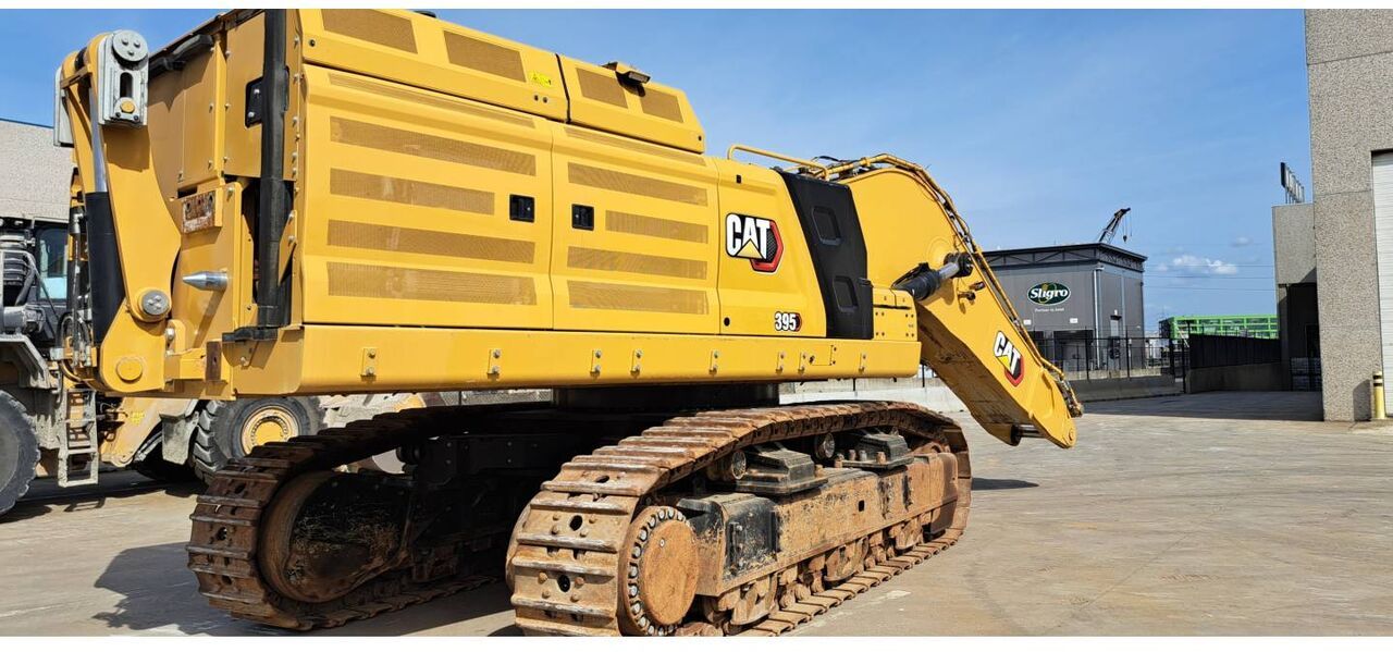 2021 Caterpillar 395-07 crawler excavator, rear three-quarter view