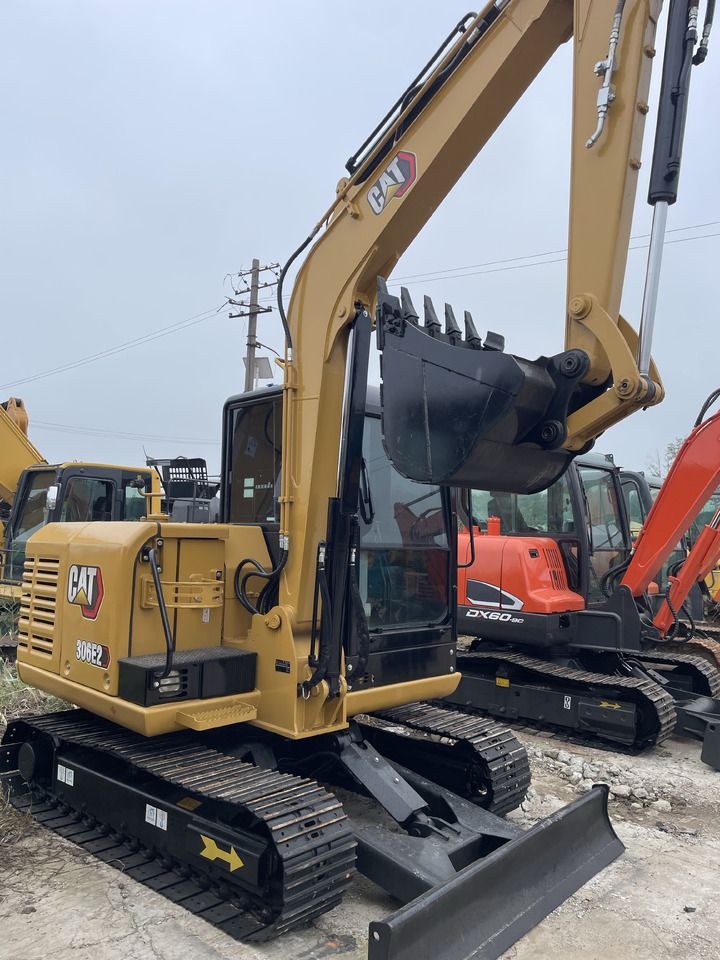 2023 Caterpillar 306E2 mini excavator, rear three-quarter view 2023 Caterpillar 306E2 mini excavator, rear three-quarter view