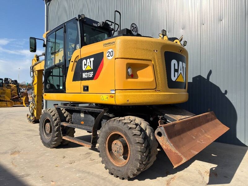 2017 Caterpillar M315F wheel excavator rear three-quarter view